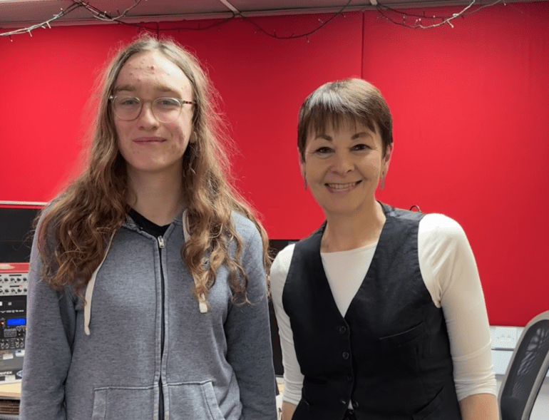 Josie and Caroline Lucas standing in a Bailrigg FM studio.
